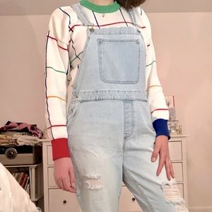 Light-wash distressed denim overalls